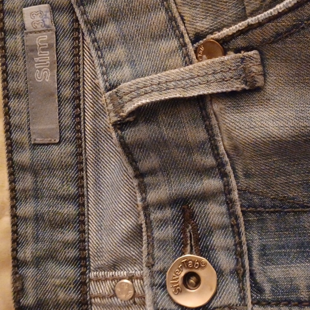 Silver Tab slim jeans in a distressed washed denim look size 33×34